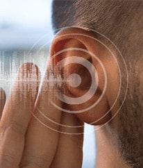 Man's ear with sound waves